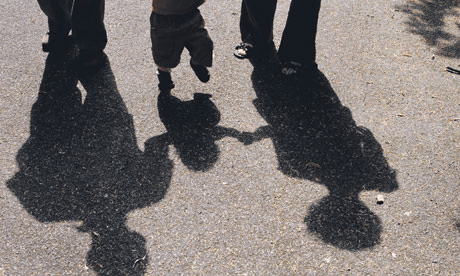 Shadow of family holding hands